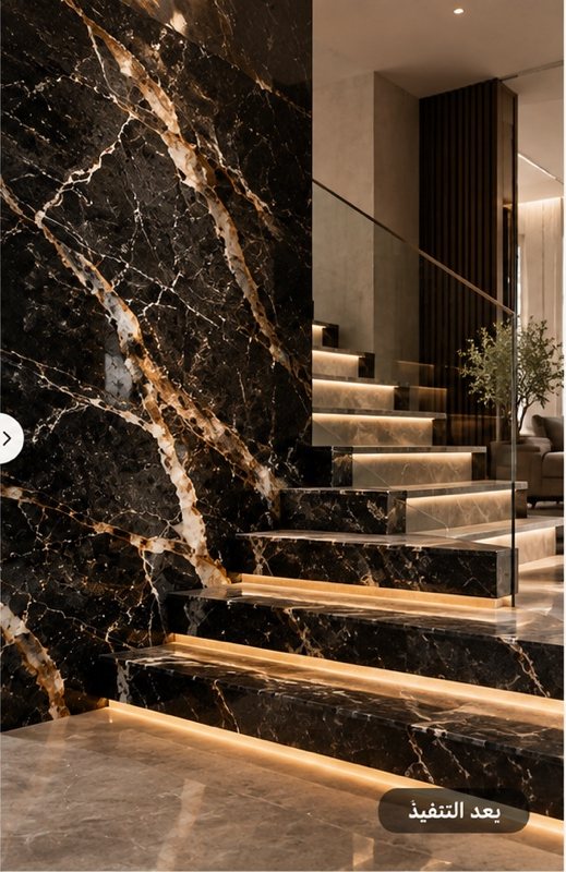 The same black marble finished as a lit staircase and wall cladding